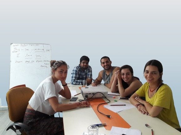 Students learning Hindi with a native teacher at Indian Lingua in Jaipur
